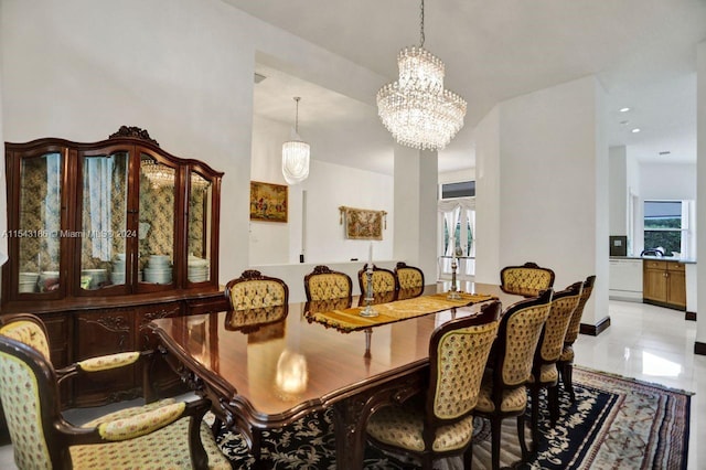 dining space featuring an inviting chandelier and a healthy amount of sunlight