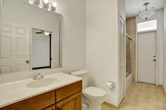 full bathroom featuring shower / bath combination with glass door, vanity, and toilet