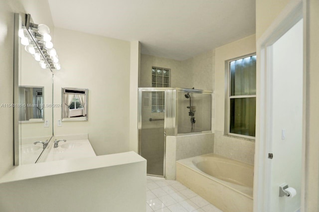 bathroom with independent shower and bath, tile patterned flooring, and vanity