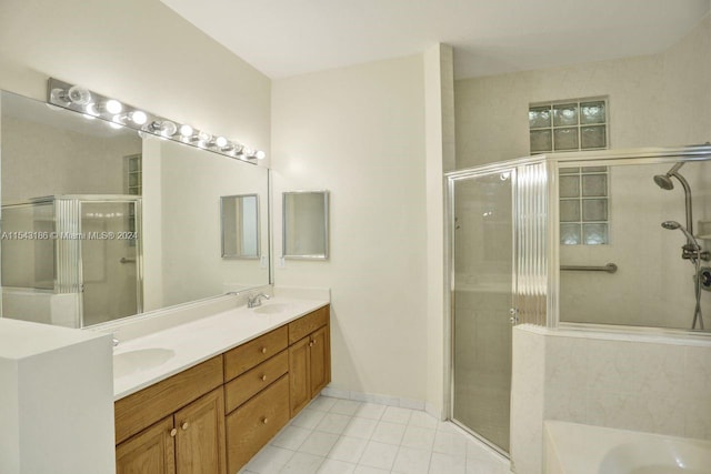 bathroom with independent shower and bath, tile patterned flooring, and vanity