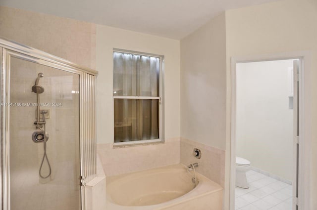 bathroom with toilet, shower with separate bathtub, and tile patterned flooring