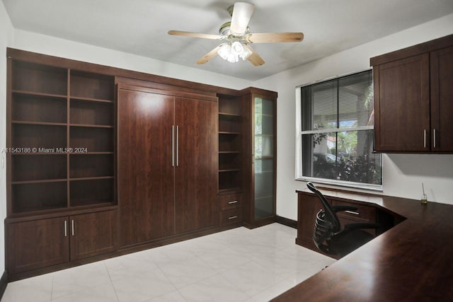 office area featuring ceiling fan and built in desk