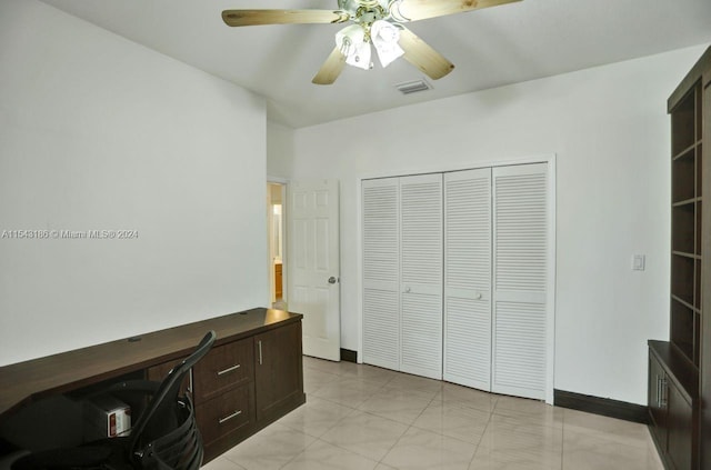 home office featuring ceiling fan and light tile patterned floors