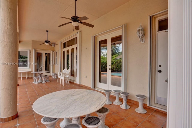 view of patio / terrace featuring ceiling fan and french doors