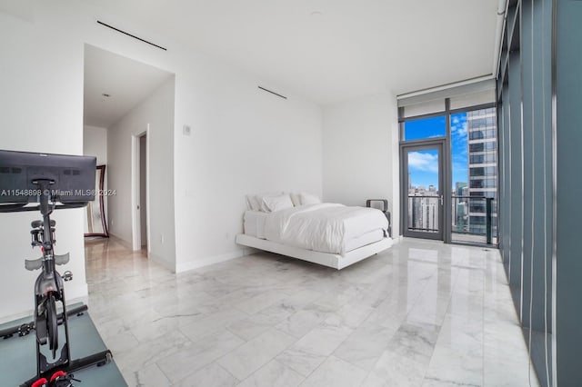 tiled bedroom with floor to ceiling windows and access to exterior