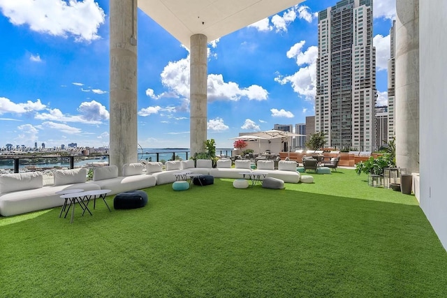 view of yard with an outdoor hangout area and a water view