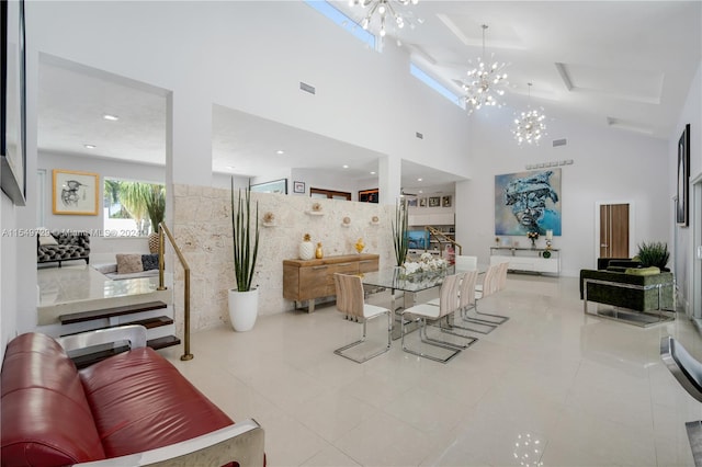 living room with tile flooring, a notable chandelier, and a towering ceiling