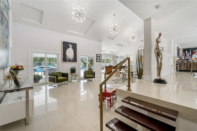 interior space featuring a high ceiling, a chandelier, and light tile floors