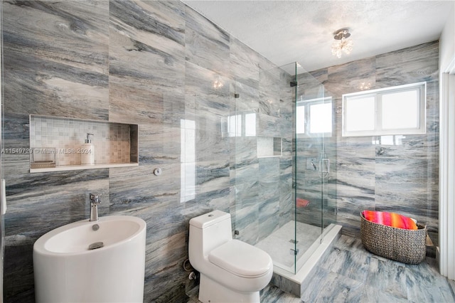 bathroom with a shower with shower door, toilet, and tile walls