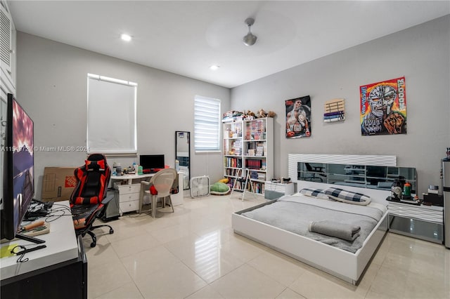 office with ceiling fan and light tile floors