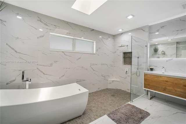 bathroom featuring tile walls, a shower with shower door, vanity, and tile flooring