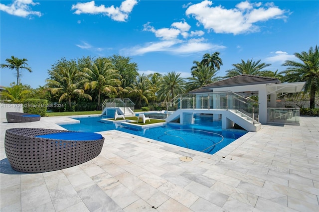 view of swimming pool featuring a jacuzzi, a patio, and a gazebo