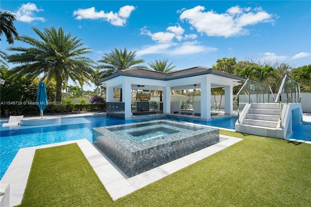 view of pool with pool water feature, a patio, a gazebo, an outdoor hot tub, and a yard