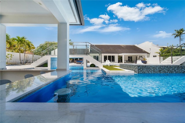 view of pool featuring a patio