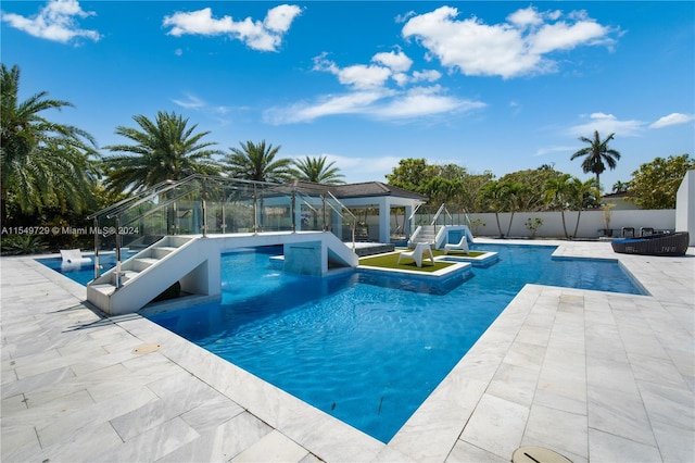 view of pool featuring a patio area and pool water feature