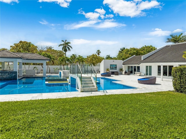 view of swimming pool with a yard and a patio