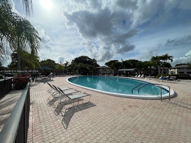 view of swimming pool featuring a patio