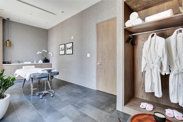 interior space featuring dark tile floors