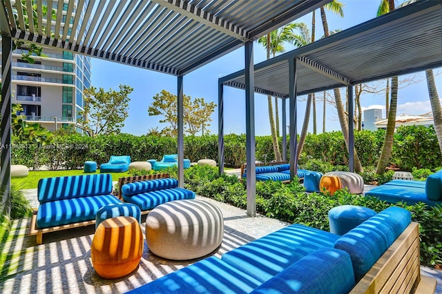 exterior space featuring an outdoor hangout area and a pergola