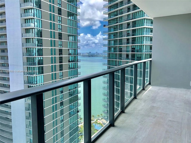 balcony featuring a water view