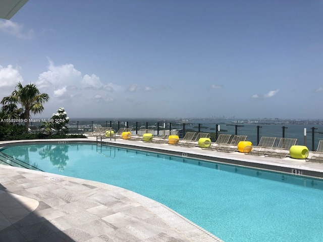 view of swimming pool with a patio area