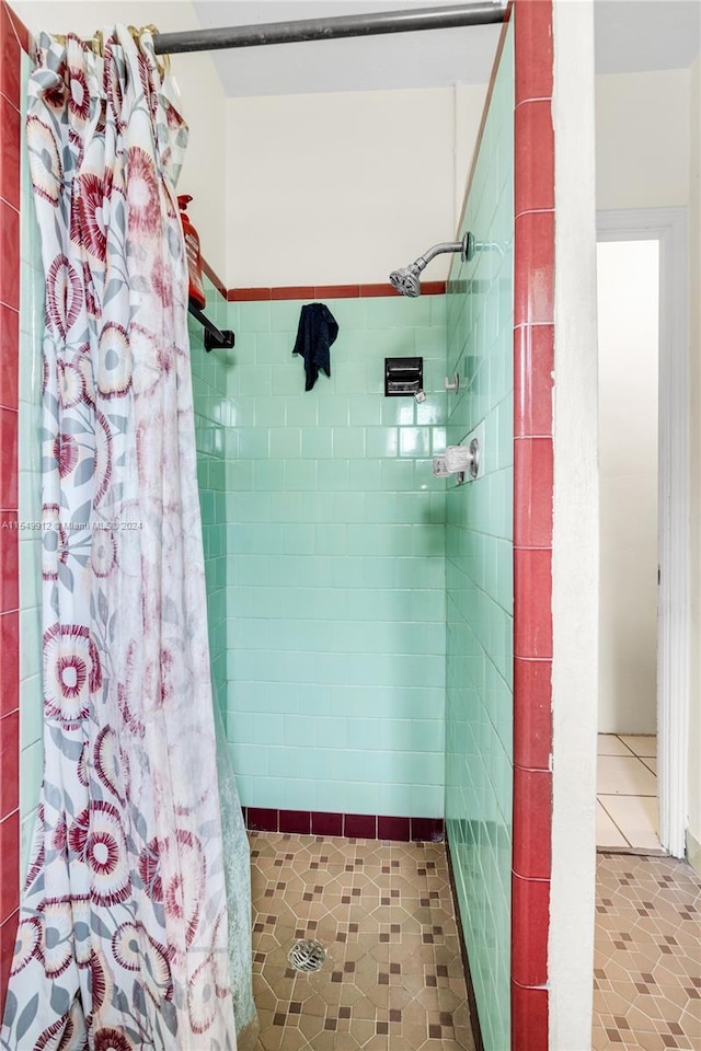 full bath featuring a shower stall