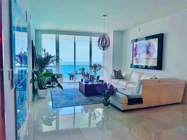 living room with a water view and a wall of windows