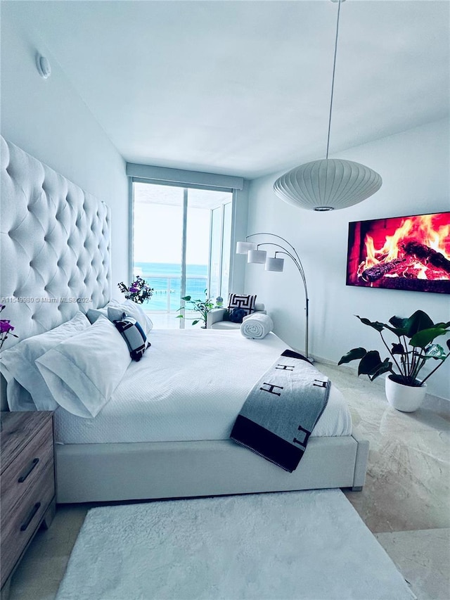 bedroom featuring a water view