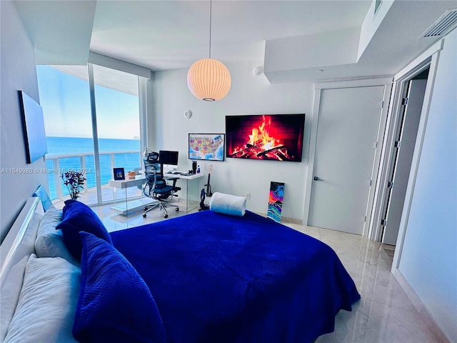 bedroom featuring floor to ceiling windows