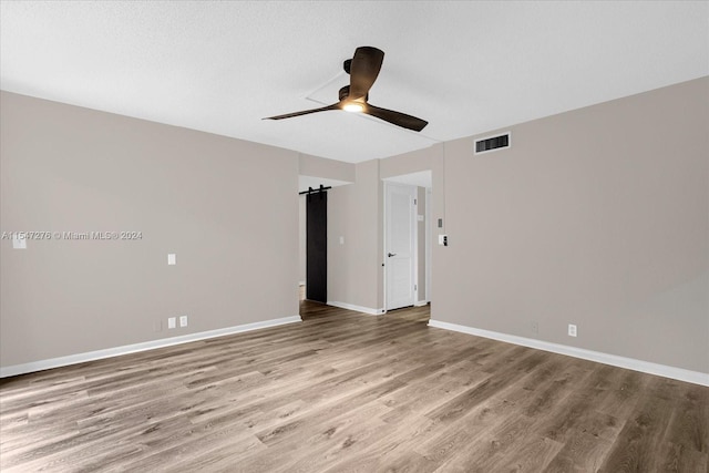 spare room featuring ceiling fan and wood-type flooring