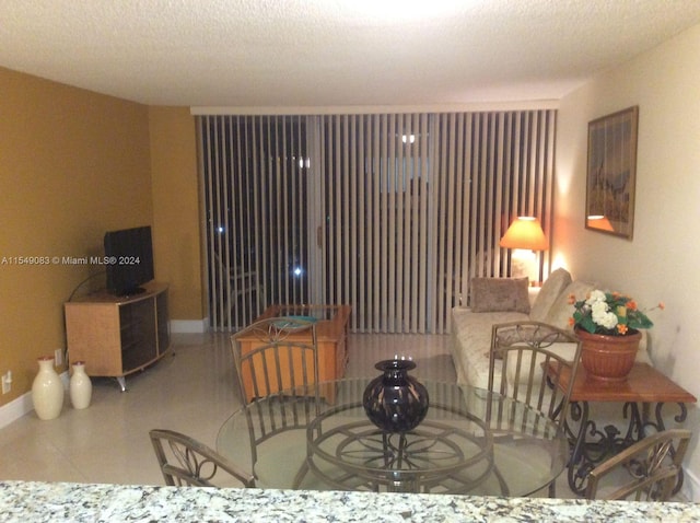 tiled living room with a textured ceiling