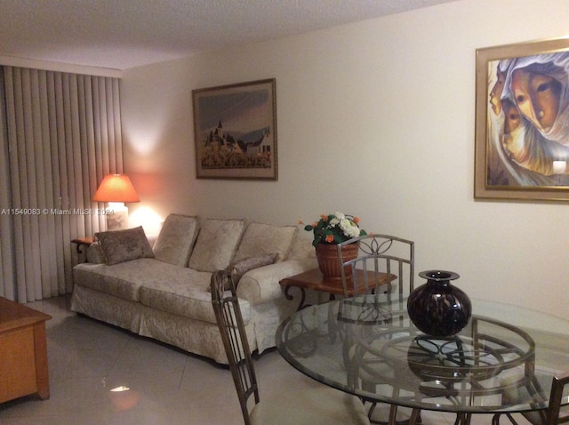 tiled living room with a textured ceiling