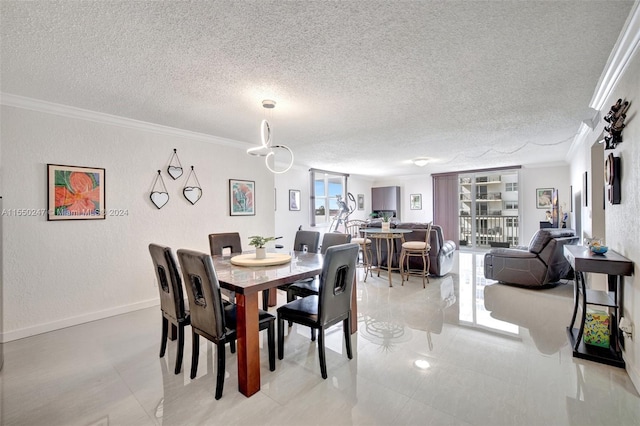 tiled dining area featuring ornamental molding and a textured ceiling