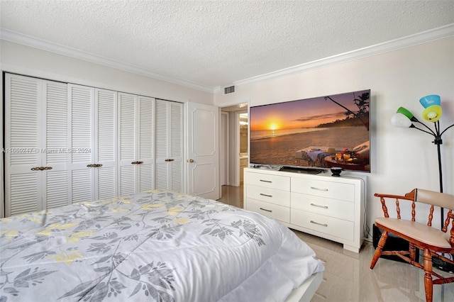 tiled bedroom featuring crown molding, a textured ceiling, and a closet