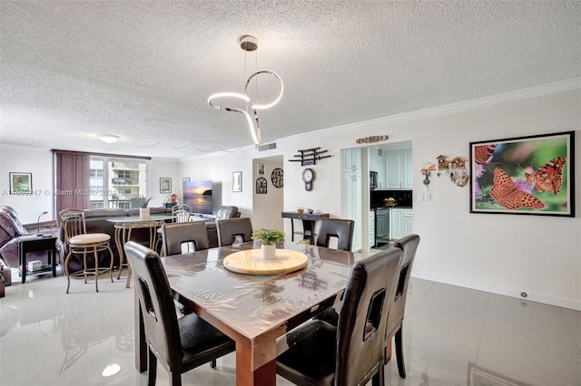 dining space featuring a textured ceiling, tile floors, and crown molding