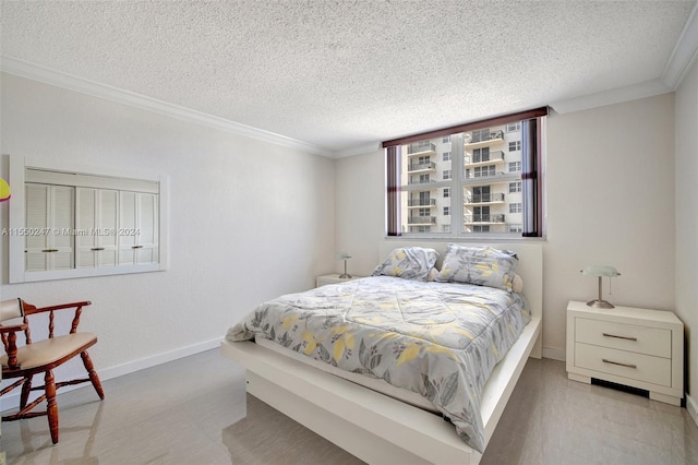 bedroom featuring crown molding and a textured ceiling