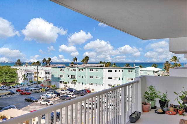 balcony featuring a water view