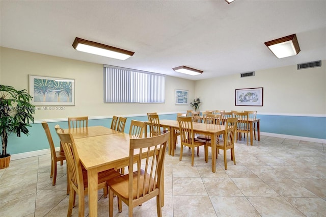 dining room with light tile flooring