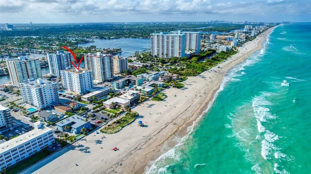 aerial view featuring a water view and a beach view