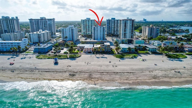 bird's eye view with a beach view and a water view