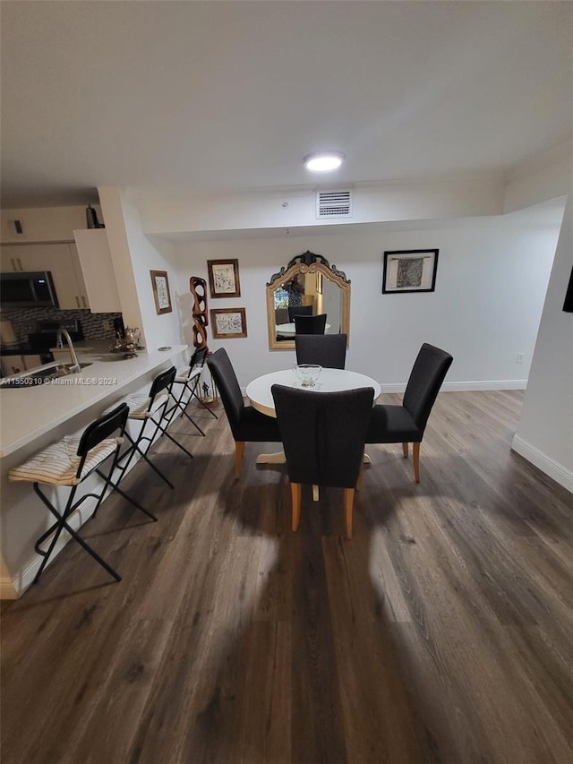 dining area featuring hardwood / wood-style floors