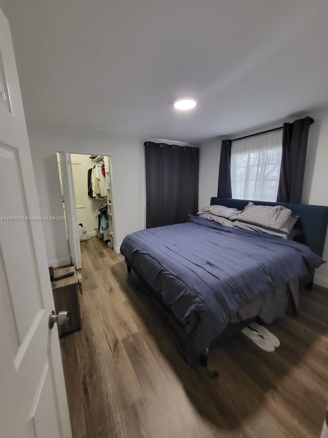 bedroom with light hardwood / wood-style flooring