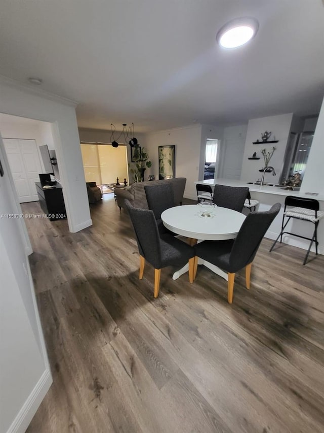 dining area featuring wood-type flooring