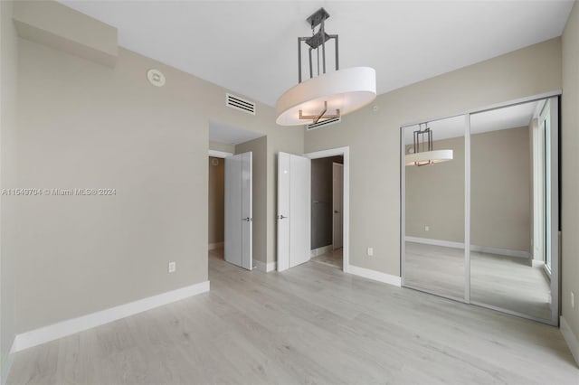 spare room with light wood-type flooring