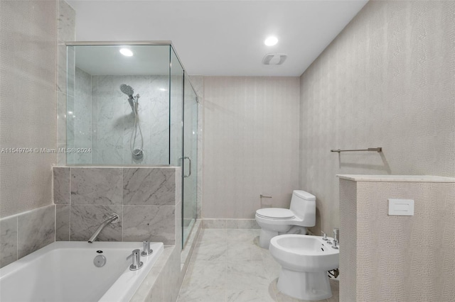 bathroom featuring tile flooring, a bidet, toilet, and separate shower and tub