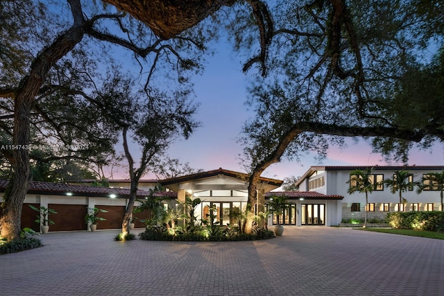 mediterranean / spanish house featuring a garage