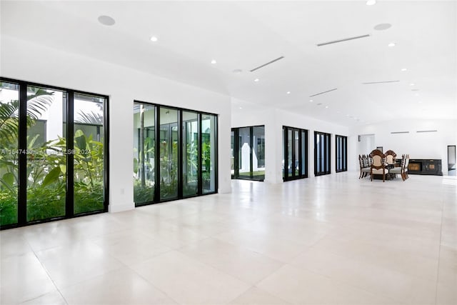 unfurnished room featuring light tile flooring