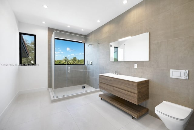 bathroom with tile walls, tile flooring, and toilet