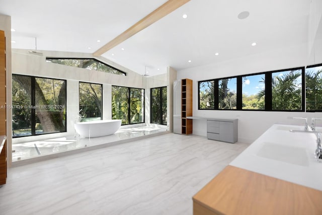 interior space with lofted ceiling with beams and sink