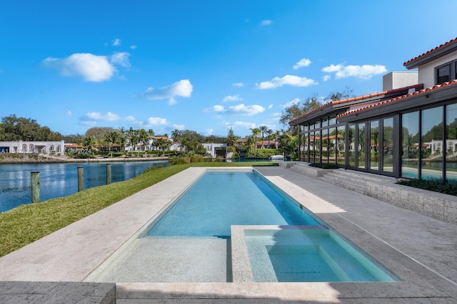 view of swimming pool with a water view